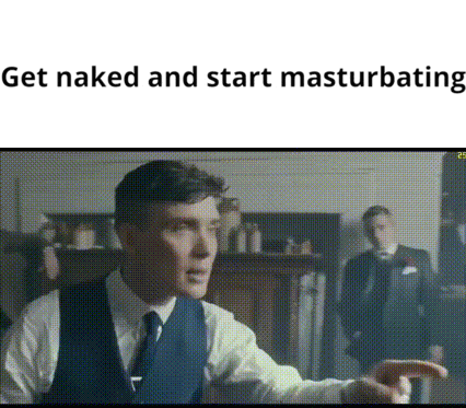 a man in a suit and tie is pointing at another man .