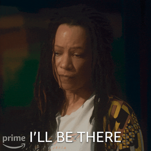a woman with dreadlocks says " i 'll be there " on a screen