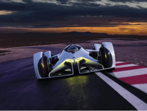 a futuristic race car is driving on a track at night