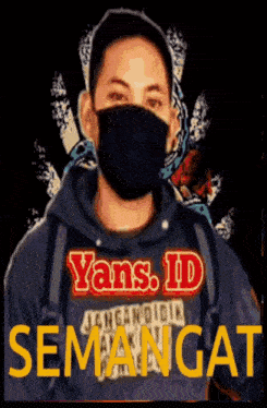 a man wearing a mask with the words yans.id semangat written on it