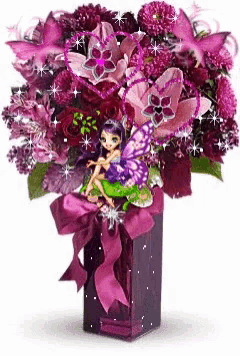 a bouquet of purple flowers with a fairy sitting on a flower