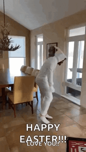 a person wearing bunny ears is dancing in a living room .