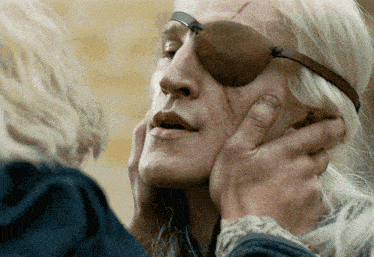 a woman with a pirate eye patch on her face