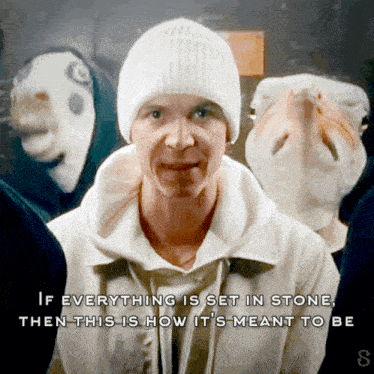 a man wearing a white beanie is surrounded by masks and a quote that says if everything is set in stone