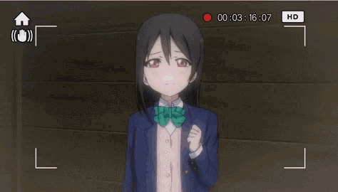 a video of a girl with a green tie is being recorded in hd
