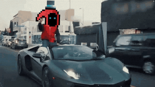 a man in a red top hat is riding in a black sports car