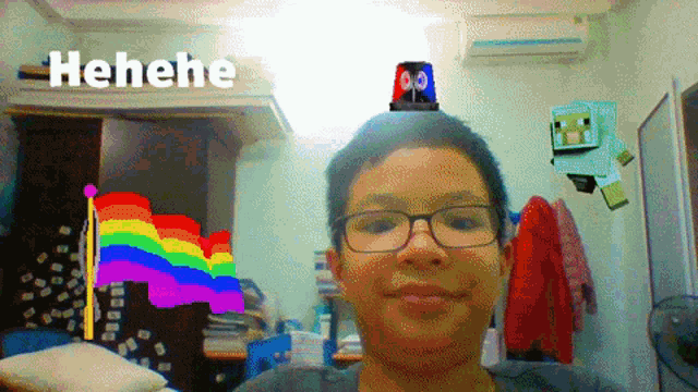 a boy with glasses has a rainbow flag on his head and the word henehe is above him