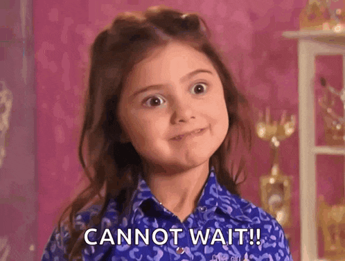a little girl in a blue shirt is making a funny face and says cannot wait .