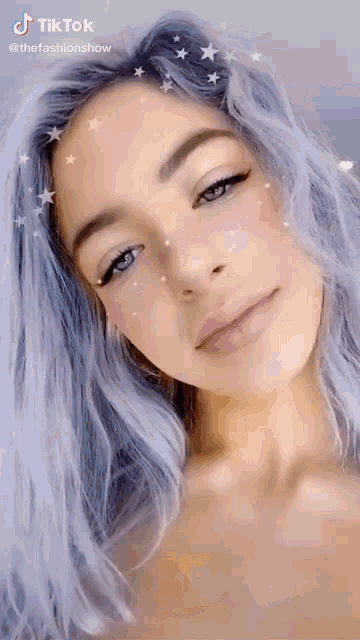 a close up of a woman 's face with a tiktok watermark