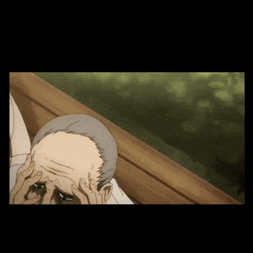 a man with gray hair is laying on a wooden bench