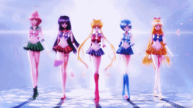 a group of sailor moon characters are standing in a line