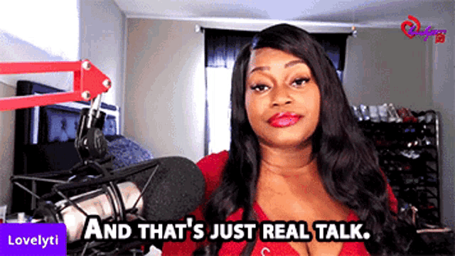a woman standing in front of a microphone with the words " and that 's just real talk " below her