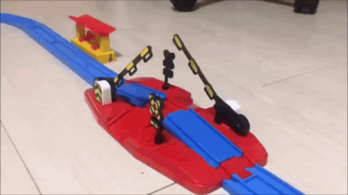 a toy train set with a red and blue track