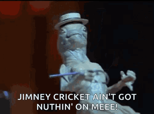 a statue of a lizard wearing a hat and holding a wand is dancing .