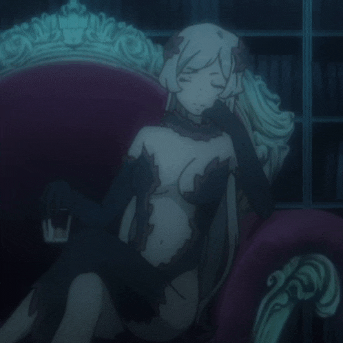 a woman in a black dress is sitting on a chair with her eyes closed
