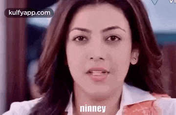 a close up of a woman 's face with the word nnney written on her face .