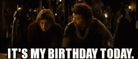 two men are standing next to each other in a dark room and they are saying it 's my birthday today .