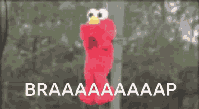 a blurred image of a santa claus hanging from a pole with the words braaaaaaaap written below it
