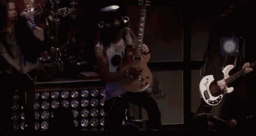 a man playing a guitar and a man playing a bass