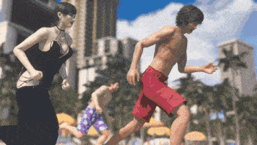 a man in red shorts is running with a woman in a black dress behind him