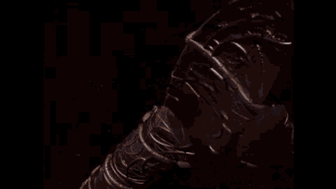 a glowing object in the dark with a blue light coming out of it .