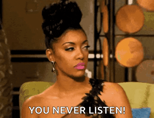 a woman in a black dress is sitting in a chair and saying you never listen