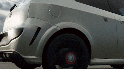 a silver car with black wheels and a red rim