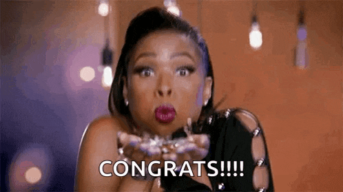 a woman is blowing a kiss and saying `` congrats !!! '' .