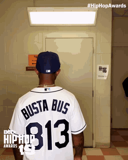 busta bus wears a baseball jersey with the number 313 on it