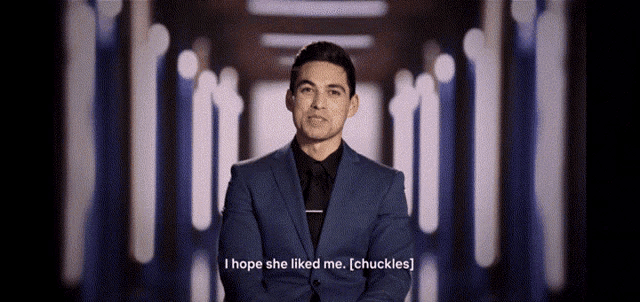 a man in a suit and tie says i hope she liked me chuckles