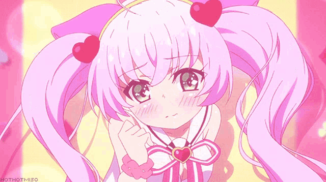 a girl with pink hair has a heart on her head and a bow around her neck
