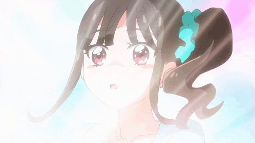 a girl with a blue ribbon in her hair looks up at something