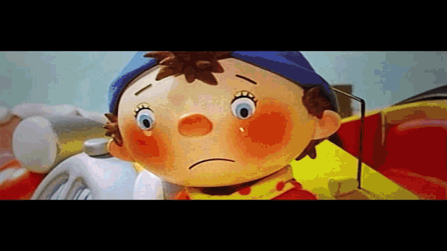 a close up of a cartoon character with a sad face