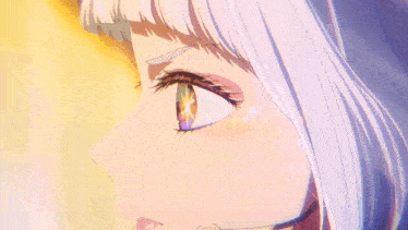 a close up of a girl 's eye with a rainbow colored iris