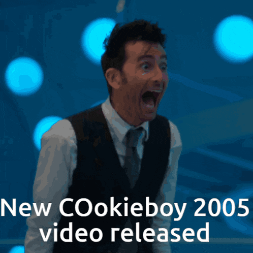 a man in a suit and tie with his mouth open and the words new cookieboy 2005 video released