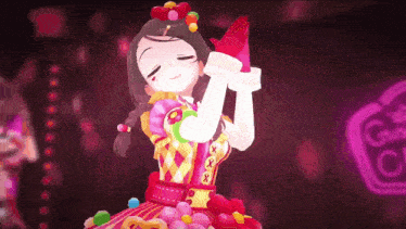 a girl in a pink dress is dancing on a stage .