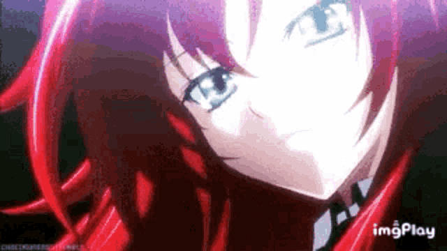 a close up of a red haired anime girl with blue eyes looking at the camera .