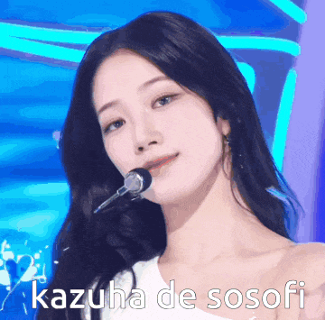 a close up of a woman singing into a microphone with the words kazuha de sosofi written on the bottom