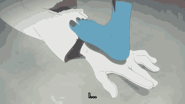 a person is laying on the ground with a blue foot on their chest .