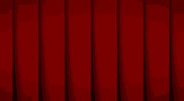 the word ocean that is on a red curtain