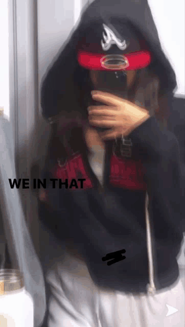 a person taking a selfie with the words we in that below