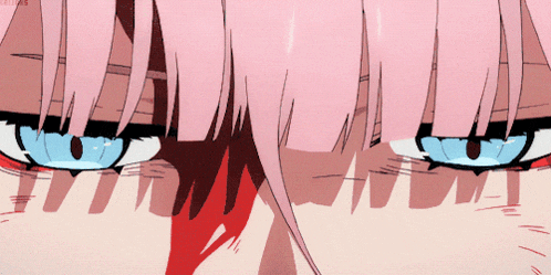 a close up of a girl 's face with pink hair