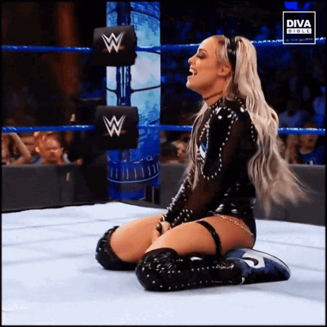 a woman is kneeling down in a wrestling ring with a diva girls logo on the bottom