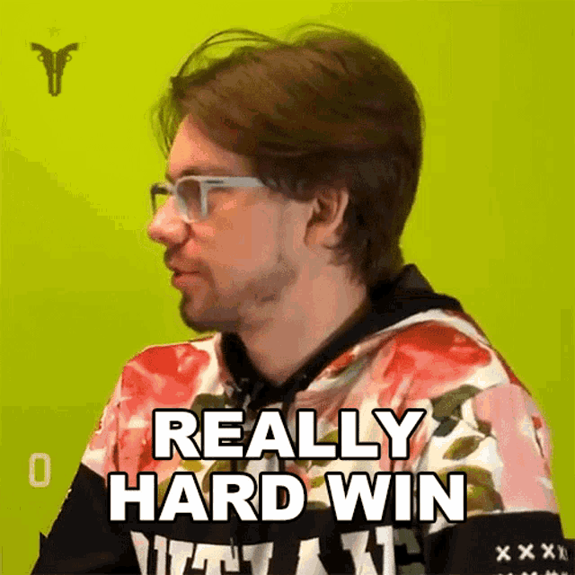 a man wearing glasses and a hoodie says really hard win