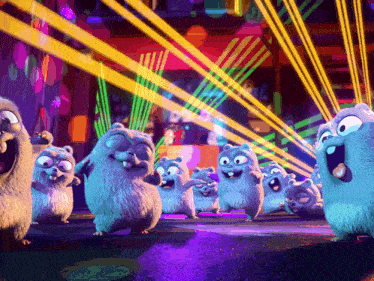 a group of ground squirrels are standing in front of a stage