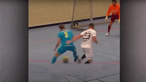 a soccer player with the number 43 on his jersey is laying on the floor