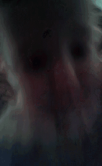 a close up of a person 's face with their eyes closed .