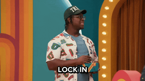 a man wearing a hat that says tri is holding a box and says lock in