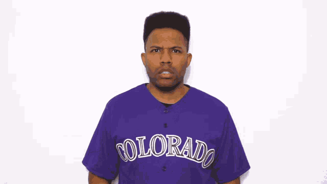 a man in a purple colorado shirt says oh my god colorado