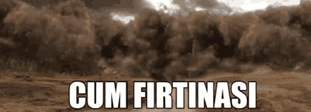 a dust storm with the words cum firtinasi written in white